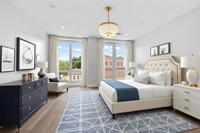 312 Fenimore St, Brooklyn, NY 11225 - bedroom with access to exterior, wood finished floors, and recessed lighting