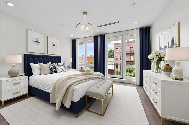 312 Fenimore St, Brooklyn, NY 11225 - bedroom featuring wood finished floors, multiple windows, a chandelier, recessed lighting, and access to exterior