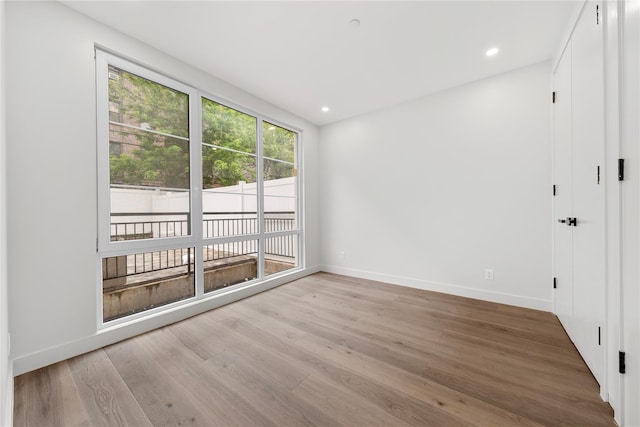 312 Fenimore St, Brooklyn, NY 11225 - empty room featuring baseboards, wood finished floors, and recessed lighting