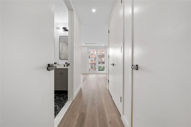 312 Fenimore St, Brooklyn, NY 11225 - corridor featuring a sink, light wood finished floors, recessed lighting, and baseboards