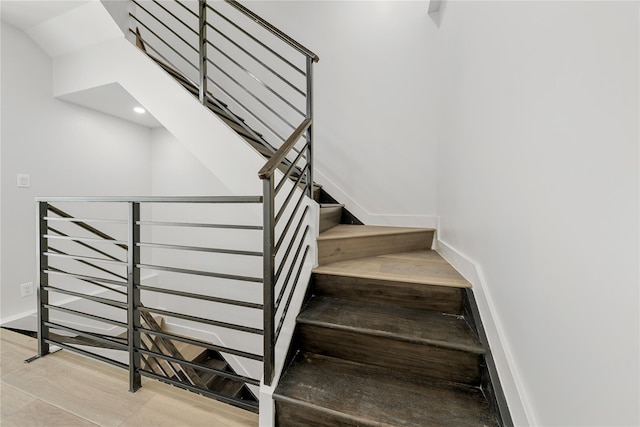 312 Fenimore St, Brooklyn, NY 11225 - staircase with baseboards, wood finished floors, and recessed lighting