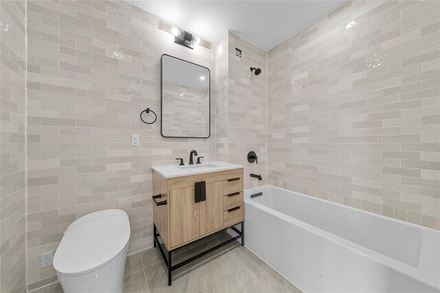 312 Fenimore St, Brooklyn, NY 11225 - full bath with tile walls, vanity, toilet, bathing tub / shower combination, and tile patterned flooring