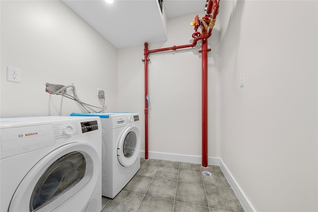 312 Fenimore St, Brooklyn, NY 11225 - laundry area featuring washer and clothes dryer and baseboards