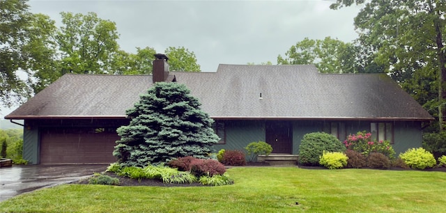 34 Brentwood Dr, Poughkeepsie, NY 12603 - view of front of house featuring a chimney, a front lawn, and a detached garage
