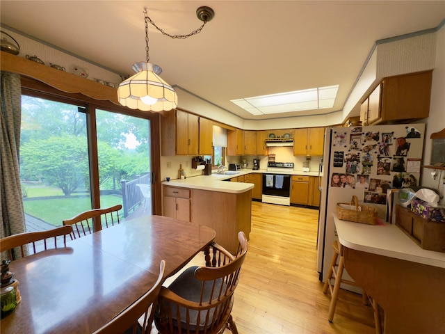 34 Brentwood Dr, Poughkeepsie, NY 12603 - kitchen featuring range with electric cooktop, a sink, light wood-style floors, light countertops, and brown cabinets