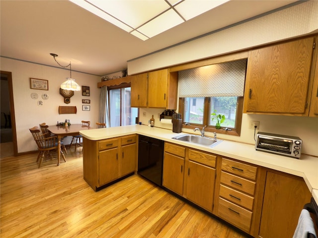 34 Brentwood Dr, Poughkeepsie, NY 12603 - kitchen with a sink, black dishwasher, a peninsula, and light countertops