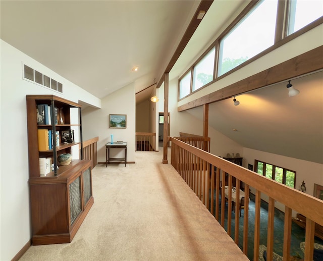34 Brentwood Dr, Poughkeepsie, NY 12603 - corridor with lofted ceiling, an upstairs landing, healthy amount of natural light, carpet flooring, and baseboards