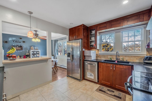 7 Daniel Ct, Lake Ronkonkoma, NY 11779 - kitchen featuring appliances with stainless steel finishes, a sink, baseboard heating, healthy amount of natural light, and recessed lighting