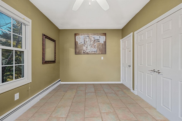 7 Daniel Ct, Lake Ronkonkoma, NY 11779 - spare room with a baseboard radiator, ceiling fan, baseboards, and light tile patterned floors