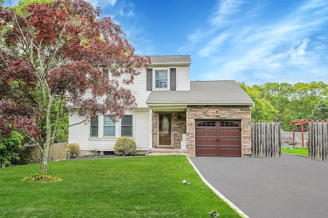 7 Daniel Ct, Lake Ronkonkoma, NY 11779 - view of front of home with a garage, driveway, stone siding, and roof with shingles