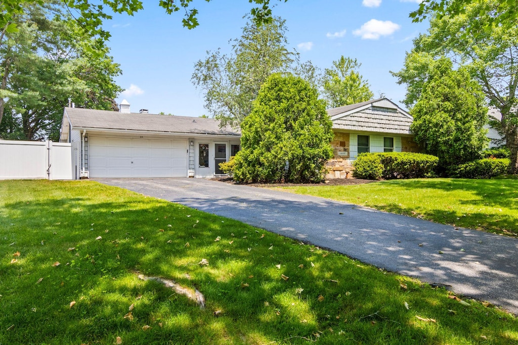25 Mystic Way, Stony Brook, NY 11790 - view of front of property with a garage and asphalt driveway