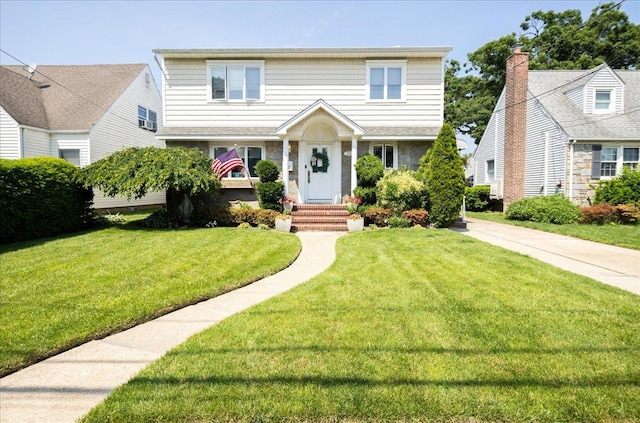 1004 Jackson Ave, Franklin Square, NY 11010 - view of front of house featuring a front lawn