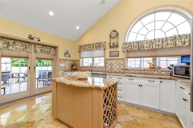 1338 Kearney Ave, Bronx, NY 10465 - kitchen with appliances with stainless steel finishes, light stone countertops, decorative backsplash, plenty of natural light, and recessed lighting