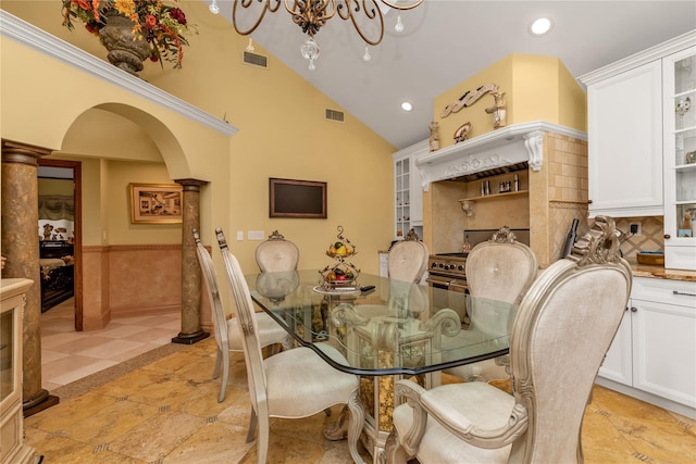 1338 Kearney Ave, Bronx, NY 10465 - dining room featuring decorative columns, recessed lighting, arched walkways, a wainscoted wall, and inlaid floor details