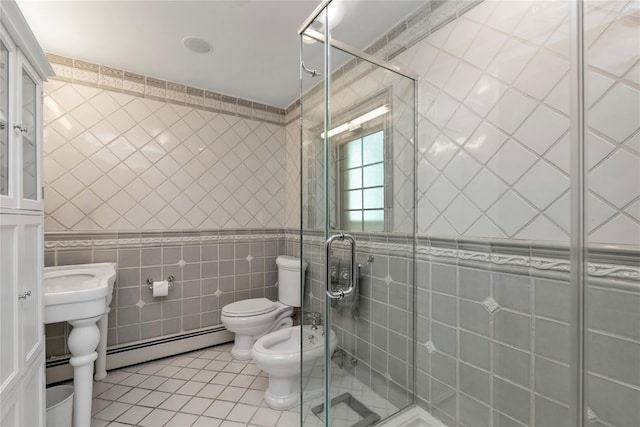 1338 Kearney Ave, Bronx, NY 10465 - bathroom with a baseboard heating unit, tile walls, tile patterned flooring, a shower stall, and a bidet