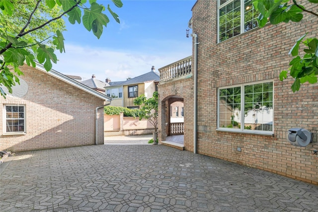1338 Kearney Ave, Bronx, NY 10465 - view of home's exterior featuring a patio and brick siding