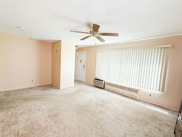 182 Edmunton Dr Unit D3, North Babylon, NY 11703 - spare room with radiator heating unit, carpet flooring, ceiling fan, baseboards, and an AC wall unit
