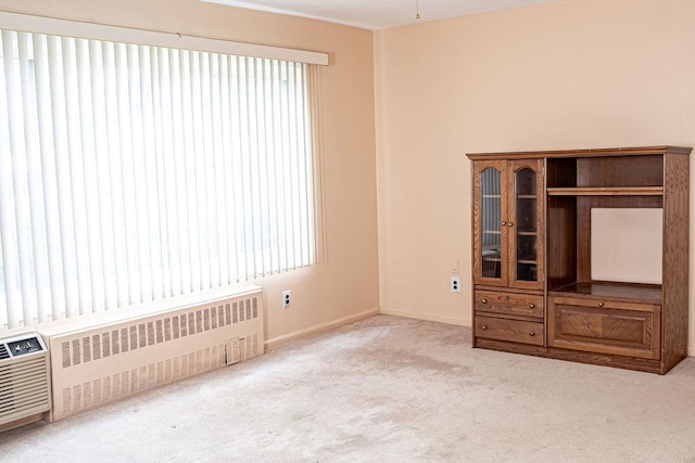 182 Edmunton Dr Unit D3, North Babylon, NY 11703 - carpeted empty room featuring radiator and baseboards