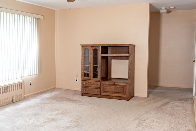 182 Edmunton Dr Unit D3, North Babylon, NY 11703 - carpeted spare room with radiator heating unit and baseboards