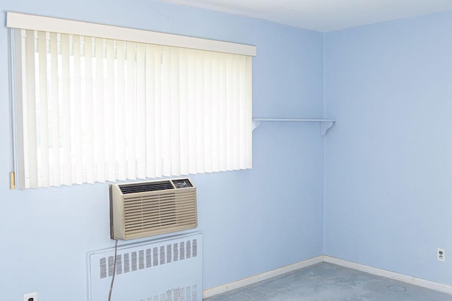 182 Edmunton Dr Unit D3, North Babylon, NY 11703 - laundry room with radiator, baseboards, and an AC wall unit