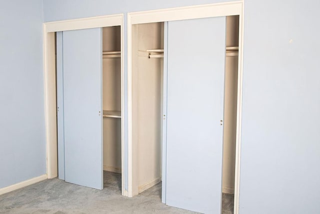 182 Edmunton Dr Unit D3, North Babylon, NY 11703 - unfurnished bedroom with carpet, two closets, and baseboards