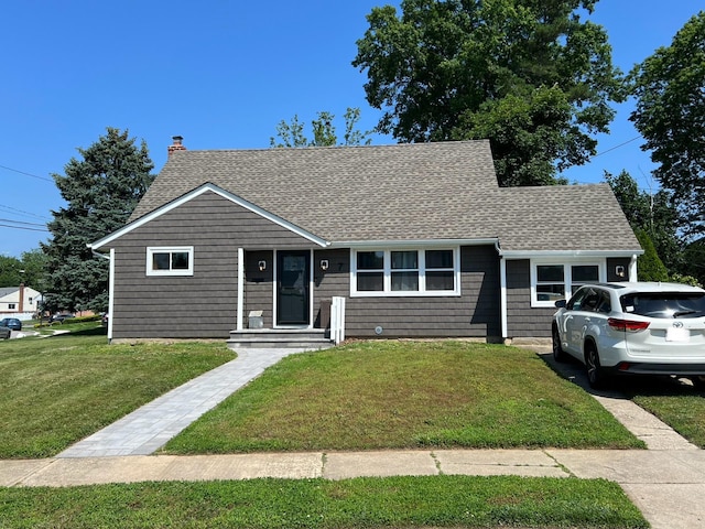 7 Mindy Ln, Jericho, NY 11590 - view of front of house featuring roof with shingles, a front yard, and a chimney