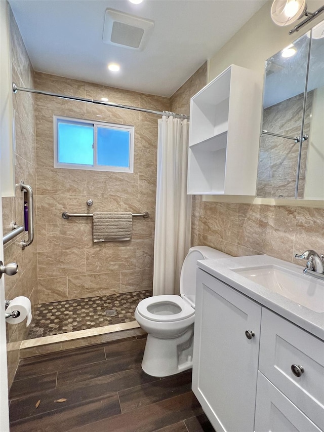 7 Mindy Ln, Jericho, NY 11590 - bathroom with vanity, a stall shower, wood finished floors, and tile walls