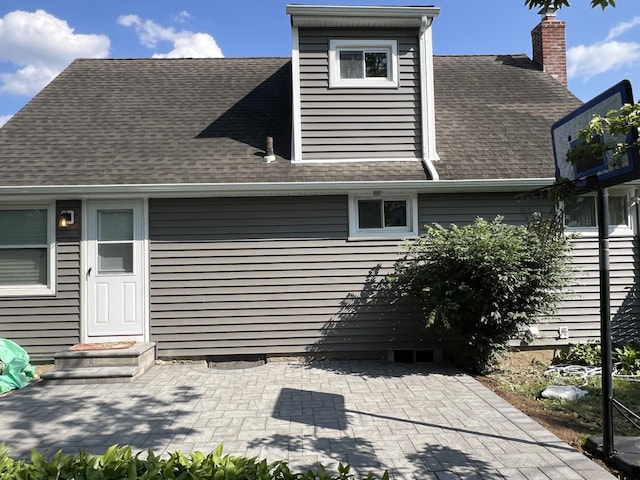 7 Mindy Ln, Jericho, NY 11590 - back of house with a shingled roof and a patio