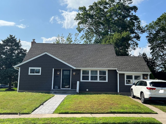 7 Mindy Ln, Jericho, NY 11590 - view of front of property with roof with shingles, a front lawn, and a chimney