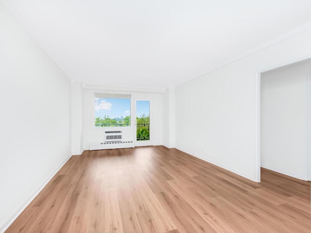 5900 Arlington Ave Unit 6S, Bronx, NY 10471 - unfurnished room featuring light wood-type flooring, a baseboard radiator, and baseboards