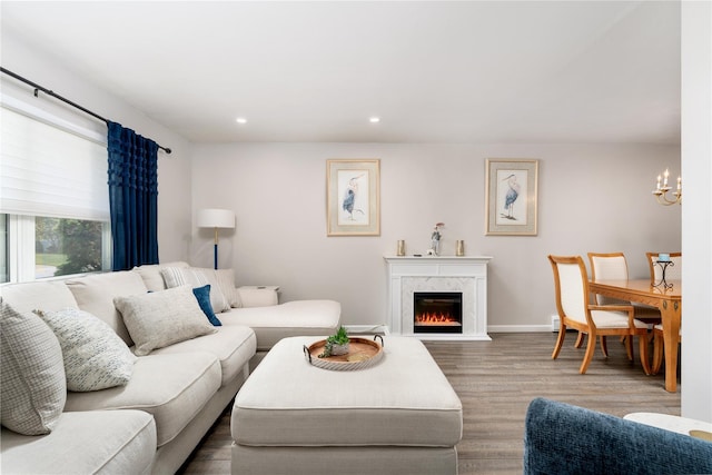 14FELWAYDRIVE Felway Dr Unit 14, Coram, NY 11727 - living room with wood finished floors, a chandelier, a premium fireplace, recessed lighting, and baseboards