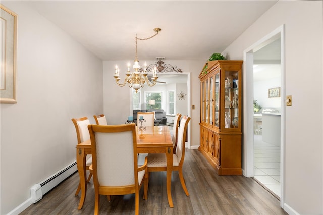 14FELWAYDRIVE Felway Dr Unit 14, Coram, NY 11727 - dining area with a baseboard heating unit, a chandelier, wood finished floors, and baseboards