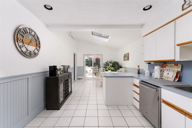 14FELWAYDRIVE Felway Dr Unit 14, Coram, NY 11727 - kitchen with dishwasher, vaulted ceiling, white cabinetry, a peninsula, and light tile patterned floors