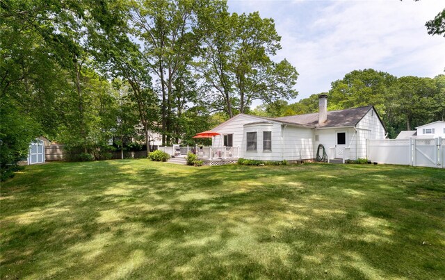 14FELWAYDRIVE Felway Dr Unit 14, Coram, NY 11727 - rear view of property with a gate, a deck, and a chimney