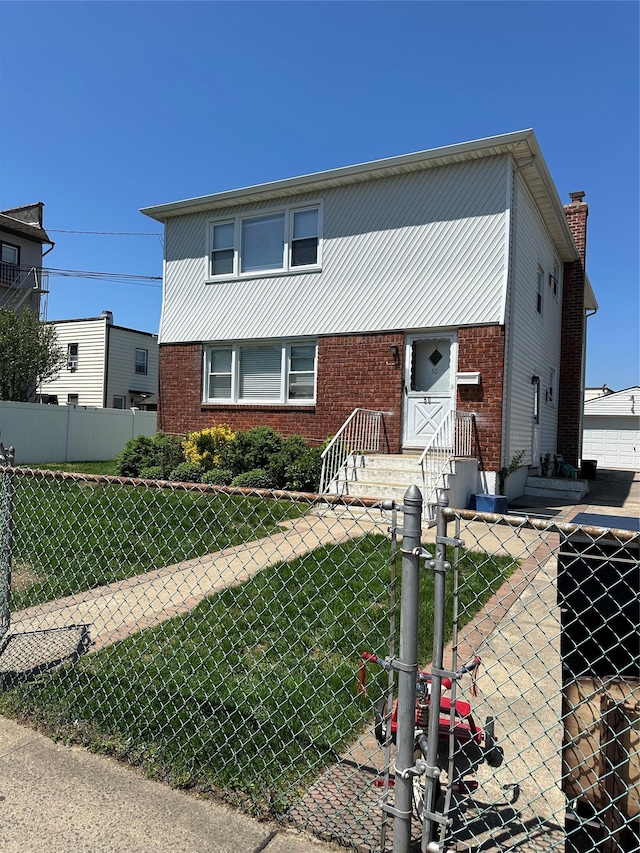 50 Mahland Pl, Oceanside, NY 11572 - view of front of house featuring brick siding and a gate