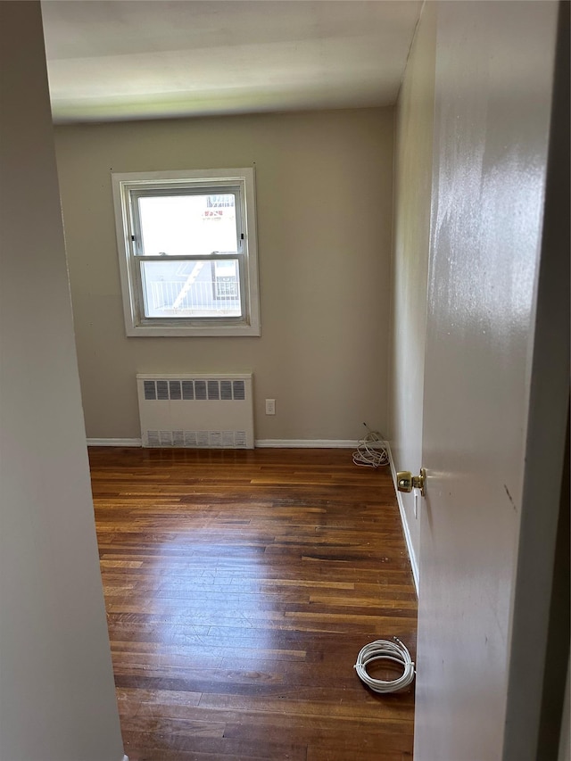 50 Mahland Pl, Oceanside, NY 11572 - spare room featuring radiator heating unit, hardwood / wood-style floors, and baseboards