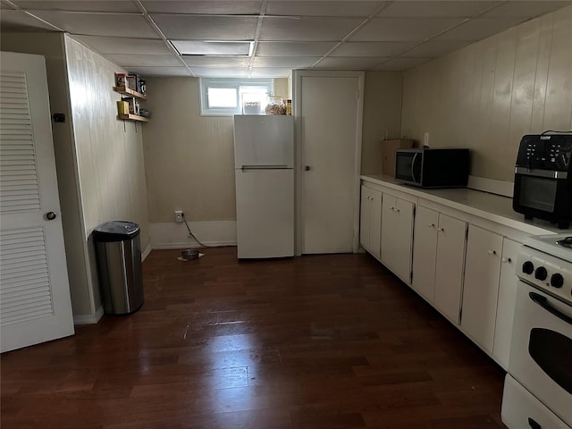 50 Mahland Pl, Oceanside, NY 11572 - kitchen featuring white appliances, a paneled ceiling, light countertops, dark wood-style flooring, and white cabinets