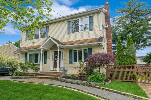 74 Miles Ave, Albertson, NY 11507 - view of front of property featuring a chimney and a gate