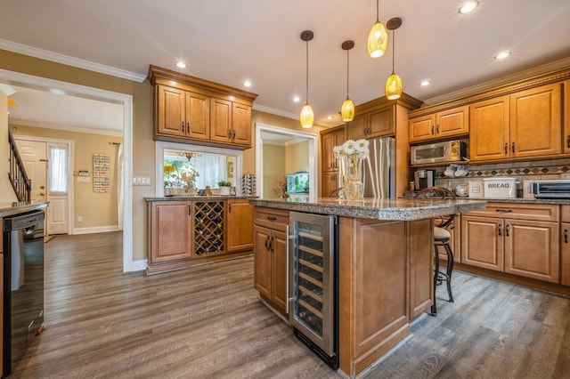 74 Miles Ave, Albertson, NY 11507 - kitchen with beverage cooler, stainless steel appliances, brown cabinetry, ornamental molding, and dark wood-style floors