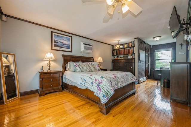 74 Miles Ave, Albertson, NY 11507 - bedroom with light wood finished floors, a ceiling fan, ornamental molding, and a wall mounted AC