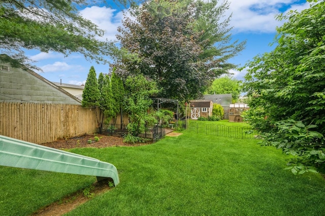 74 Miles Ave, Albertson, NY 11507 - fenced backyard with a shed