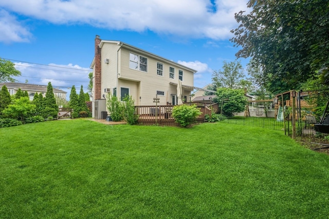 74 Miles Ave, Albertson, NY 11507 - back of house featuring a chimney and a wooden deck