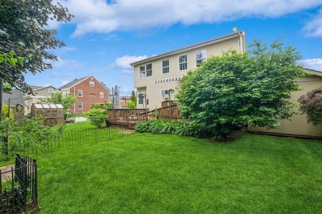74 Miles Ave, Albertson, NY 11507 - view of yard with an exterior structure, an outdoor structure, a wooden deck, and a residential view