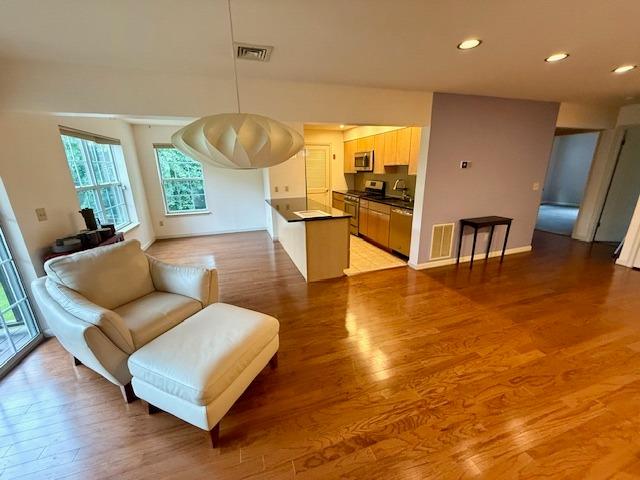 1010 Washington Grn Unit 1010, New Windsor, NY 1255312553 - living area featuring light wood-style floors and recessed lighting