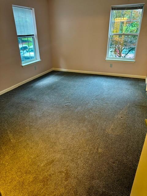 1010 Washington Grn Unit 1010, New Windsor, NY 1255312553 - empty room featuring baseboards and dark carpet