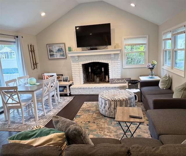 1 Roberta St, East Patchogue, NY 11772 - living area with wood finished floors, vaulted ceiling, a brick fireplace, and recessed lighting
