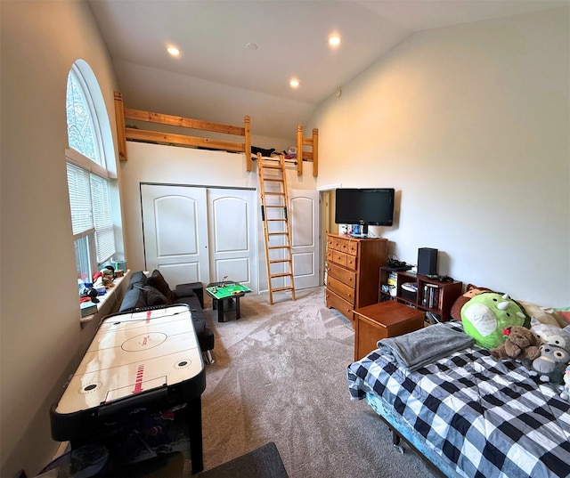 1 Roberta St, East Patchogue, NY 11772 - bedroom featuring light carpet, vaulted ceiling, and recessed lighting