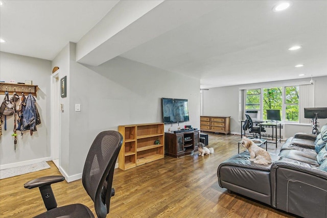 209-80 18th Ave Unit 4D, Bayside, NY 11360 - living area with a desk, wood finished floors, and recessed lighting