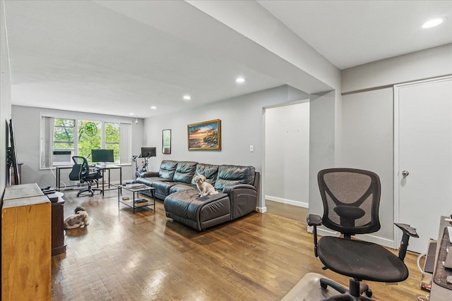209-80 18th Ave Unit 4D, Bayside, NY 11360 - living room with an office area, wood finished floors, recessed lighting, and cooling unit