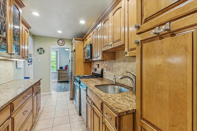 209-80 18th Ave Unit 4D, Bayside, NY 11360 - kitchen with stainless steel appliances, decorative backsplash, light stone countertops, glass insert cabinets, and light tile patterned floors